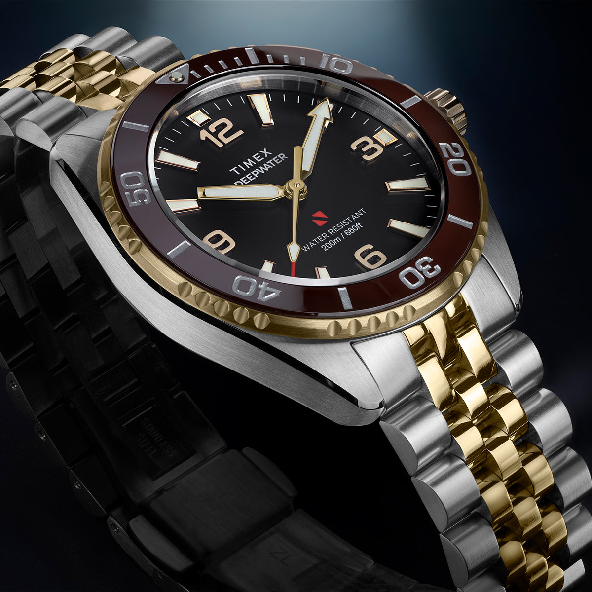 Close-up of Timex Deepwater Arctic two-tone watch with burgundy bezel and stainless steel case