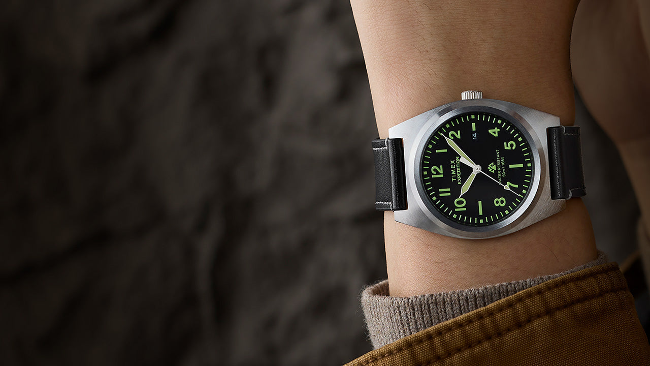 Timex Expedition Capstone watch on wrist with black dial and black leather strap