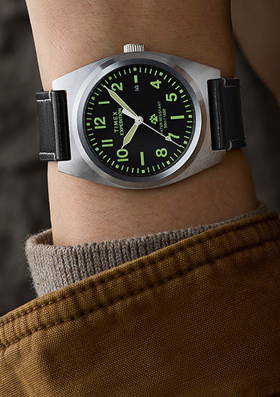 Timex Expedition Capstone watch on wrist with black dial and black leather strap