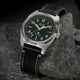 Timex Expedition Capstone watch with black dial and black leather strap on rock surface