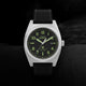 Close-up of Timex Expedition Capstone watch with black dial, Arabic numerals, and leather strap