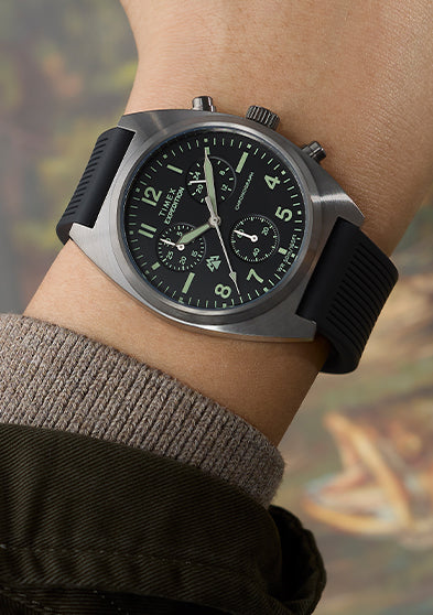 Timex Expedition Capstone Chronograph watch on wrist with black dial and black rubber strap