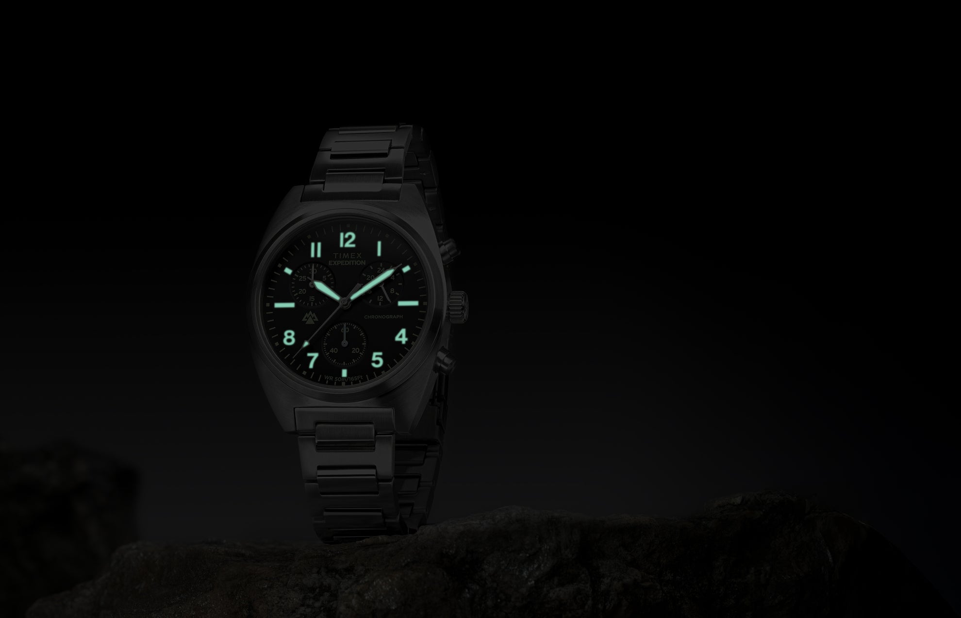 Timex Expedition Capstone Chronograph with glowing lume markers and hands in low light