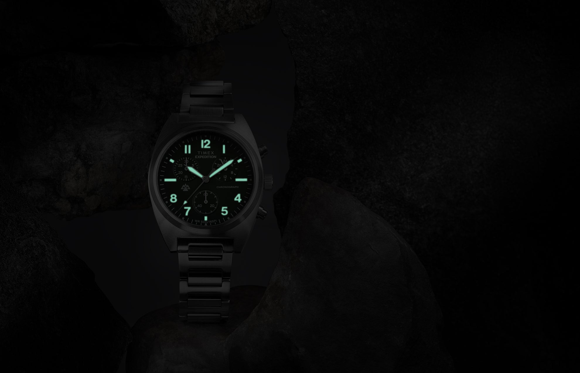 Timex Expedition Capstone Chronograph with glowing lume markers and hands in low light