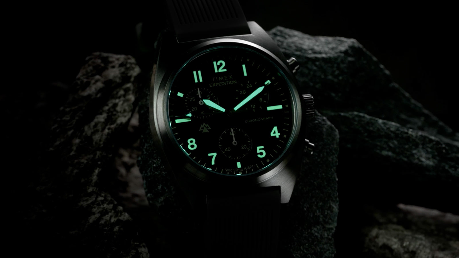 Close-up of Timex Expedition Capstone Chronograph dial with illuminated hands and markers