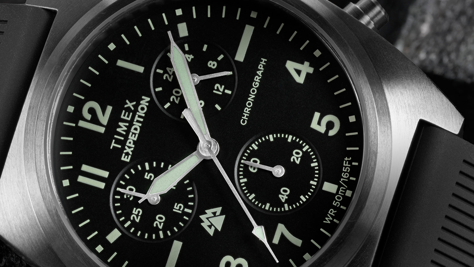 Close-up of Timex Expedition Capstone Chronograph black dial showing subdials and hour markers