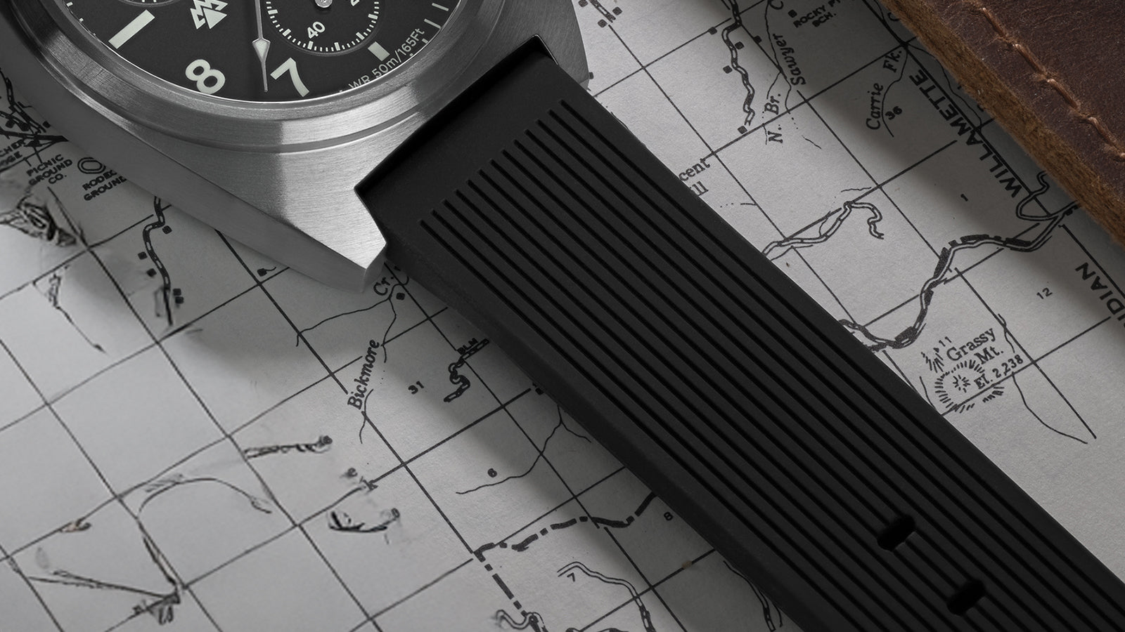 Timex Expedition Capstone Chronograph black rubber strap detail on top of map background