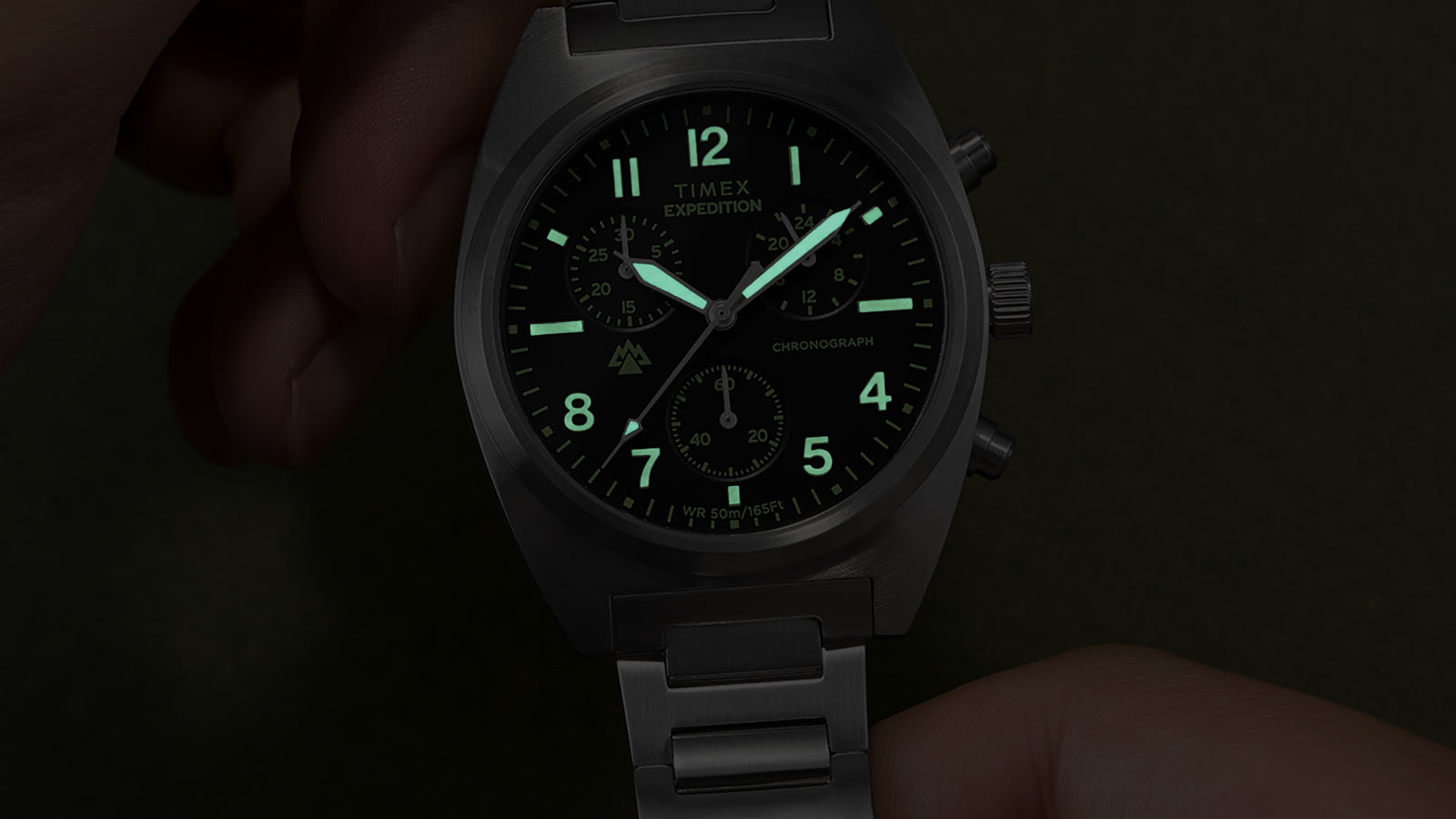Timex Expedition Capstone Chronograph dial illuminated with green lume in dark setting