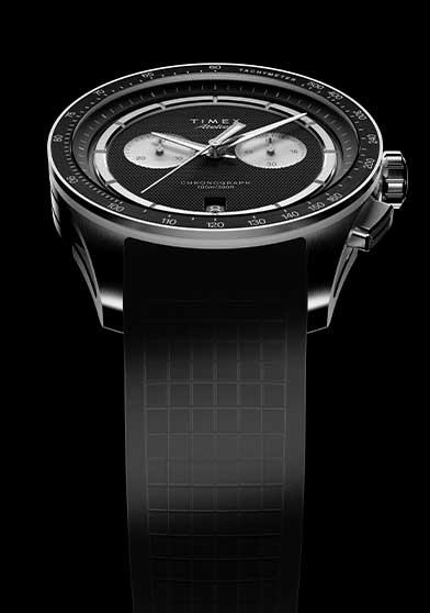 Top view of Timex Atelier Chronograph Quartz M1a 40mm with black textured dial and NBR rubber strap on black background
