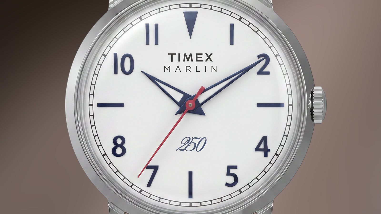 Detailed view of the Marlin America 250 dial featuring blue hour markers, blue hands, red seconds hand, and commemorative America 250 marking.