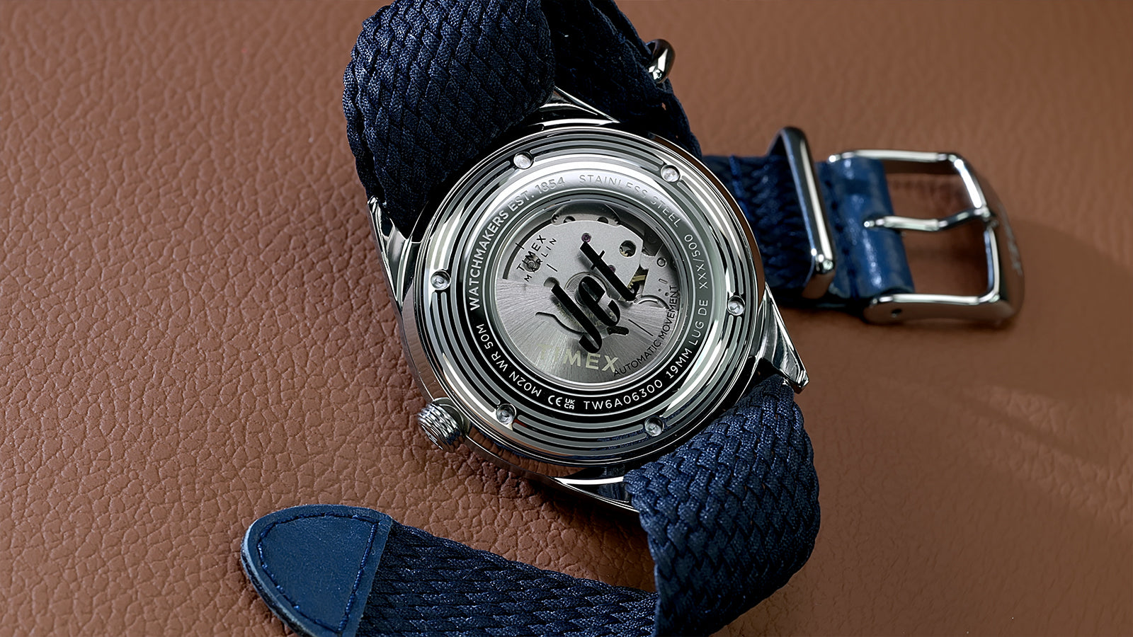 Exhibition caseback of the Marlin Jet America 250 automatic watch showcasing the automatic movement and commemorative Jet engraving.