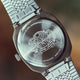 Caseback of the END. x Timex 1981 Reissue Inspired watch featuring an engraved globe and tiger design.