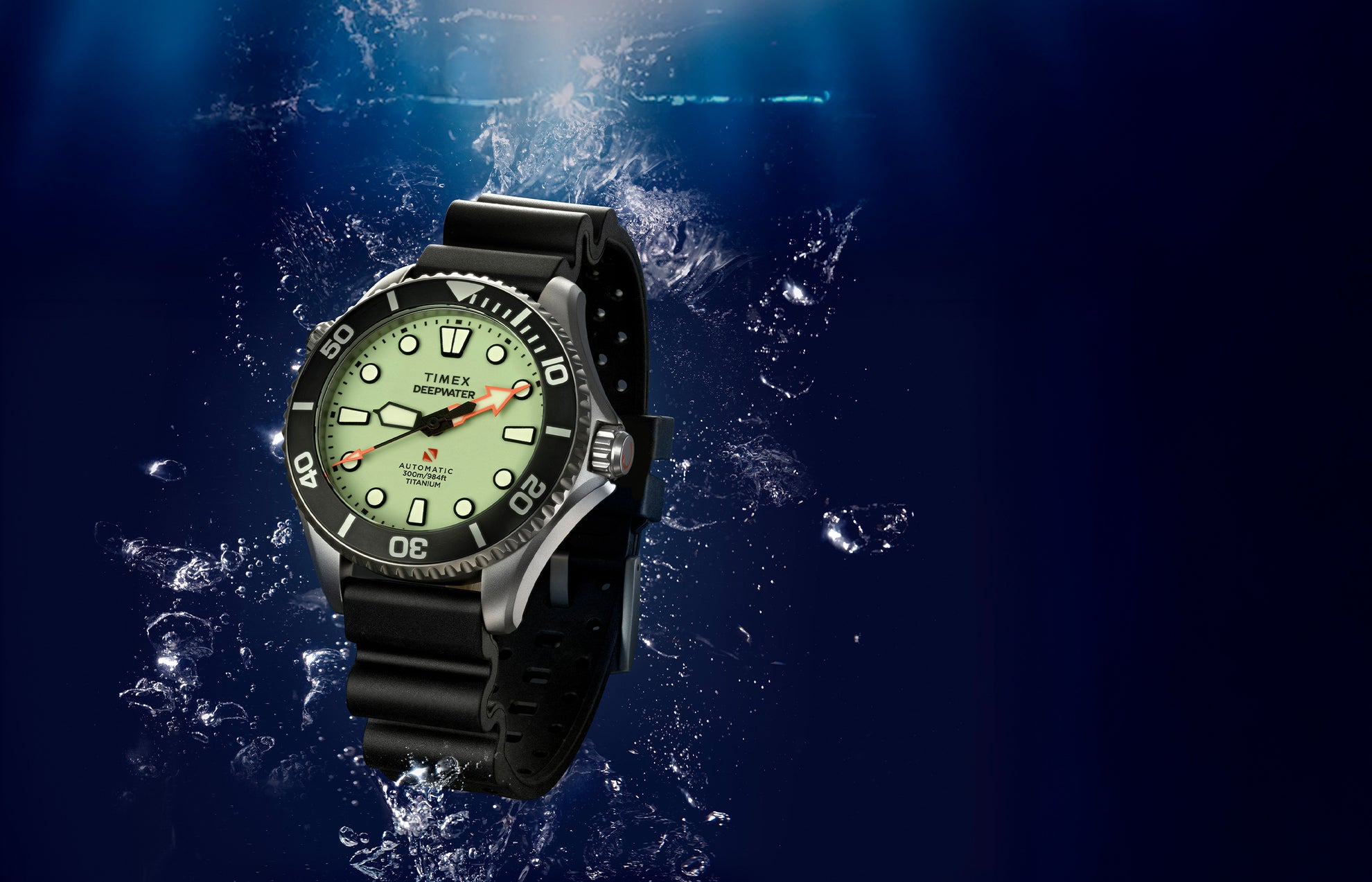 Timex Deepwater Meridian 300 Titanium HEV Automatic dive watch with full-lume dial and black rubber strap suspended in an underwater scene with rising bubbles.