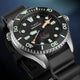 Close-up angled view of the Timex Deepwater Meridian 300 Titanium HEV Automatic showcasing luminous markers, titanium case, and black rubber strap.
