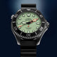 Front view of the Timex Deepwater Meridian 300 Titanium HEV Automatic showcasing its luminous dial, titanium case, and black rubber strap.