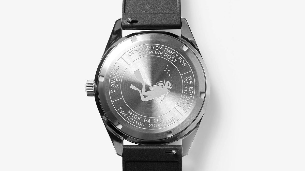 Caseback of the Bespoke Post x Timex Heritage 66 watch featuring a custom engraved outdoor design.