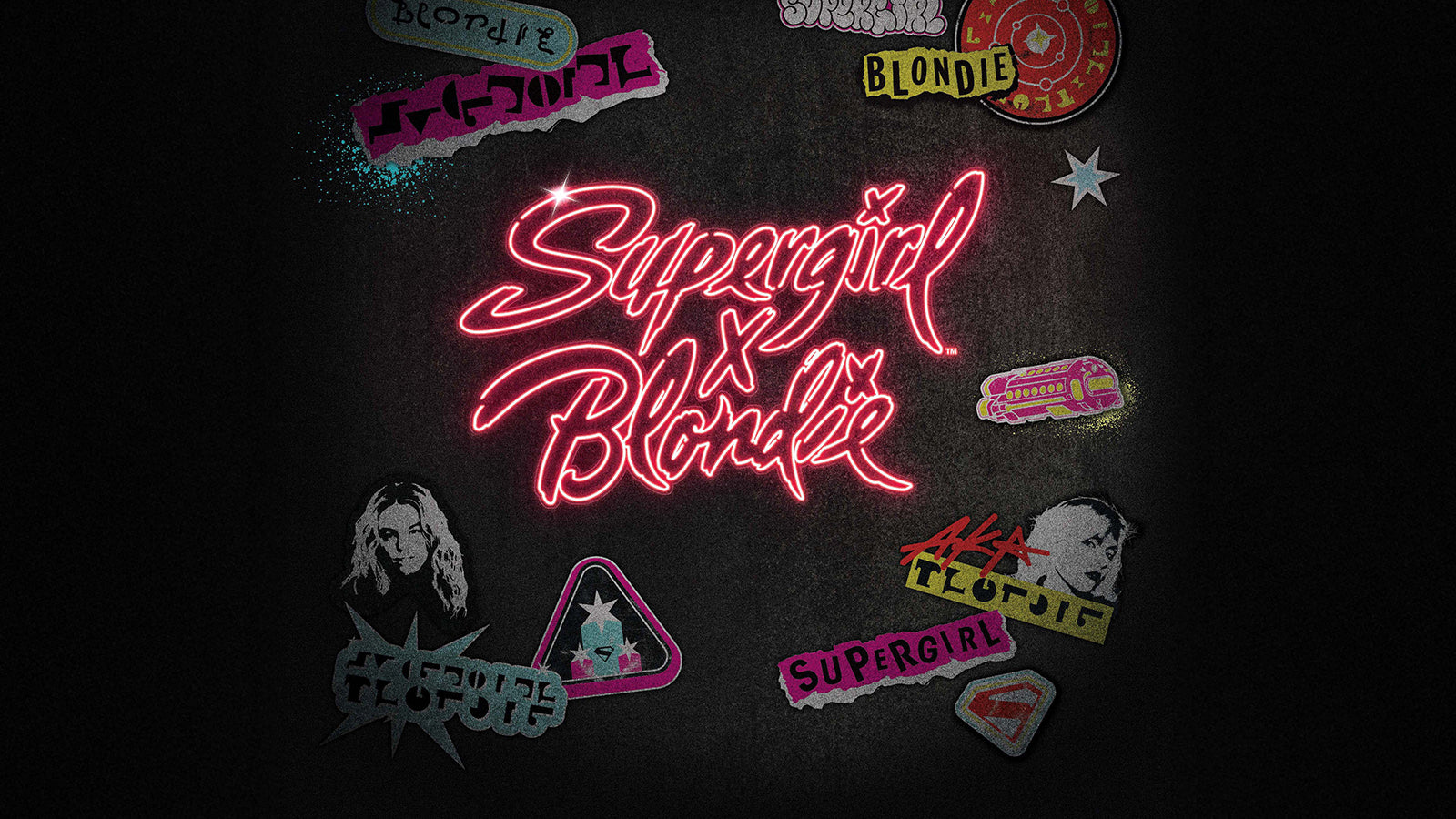 Close-up of the Supergirl x Blondie Q Timex watch floating in a moody studio setting with headphones, a microphone, and music-inspired props. The dial features a collage portrait of Blondie with colorful graphic overlays.