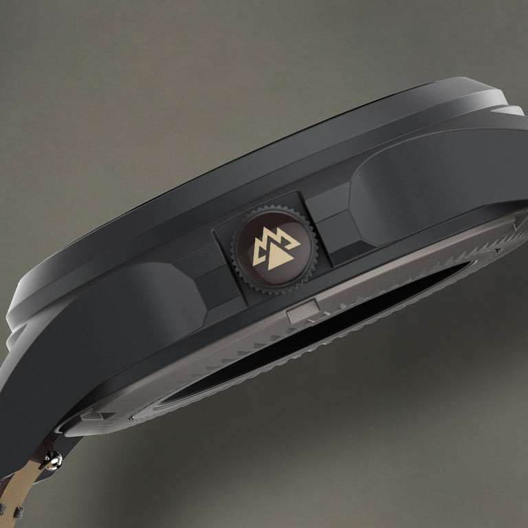 Side profile of the Expedition® Field Post Automatic titanium watch highlighting the signed screw-down crown.