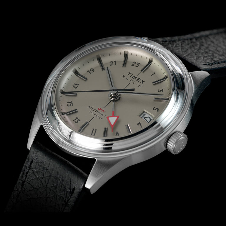 Timex Marlin Jet Titanium Automatic GMT watch with a silver dial, titanium case, and black leather strap.