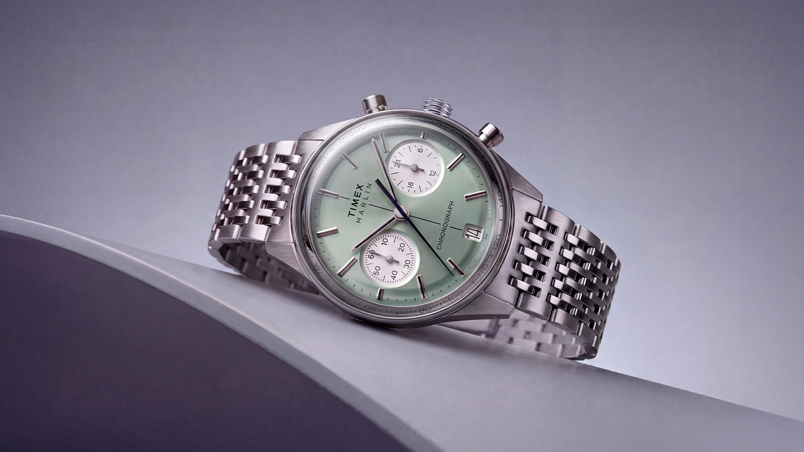 Timex Marlin® Jet Chronograph featuring a green dial, white subdials, and stainless-steel bracelet.