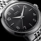 Macro view of the Timex Marlin Quartz black sunray dial with applied silver-tone Arabic numerals, luminous hands, and polished stainless steel case.