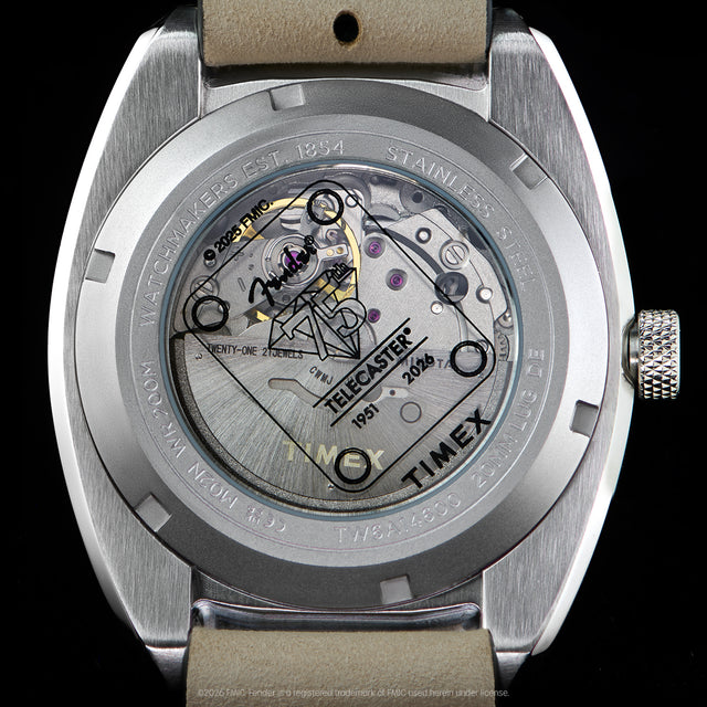 Close-up of the transparent caseback revealing the automatic movement and Fender Telecaster artwork.
