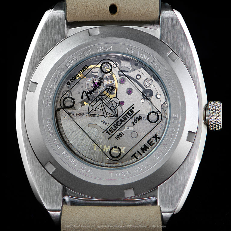 Close-up of the transparent caseback revealing the automatic movement and Fender Telecaster artwork.