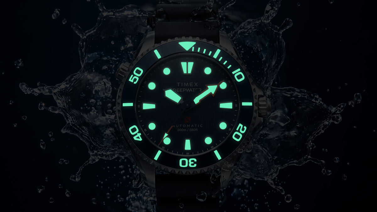 Deepwater Meridian 200 HEV Automatic in darkness with illuminated hands, hour markers, and bezel markings.