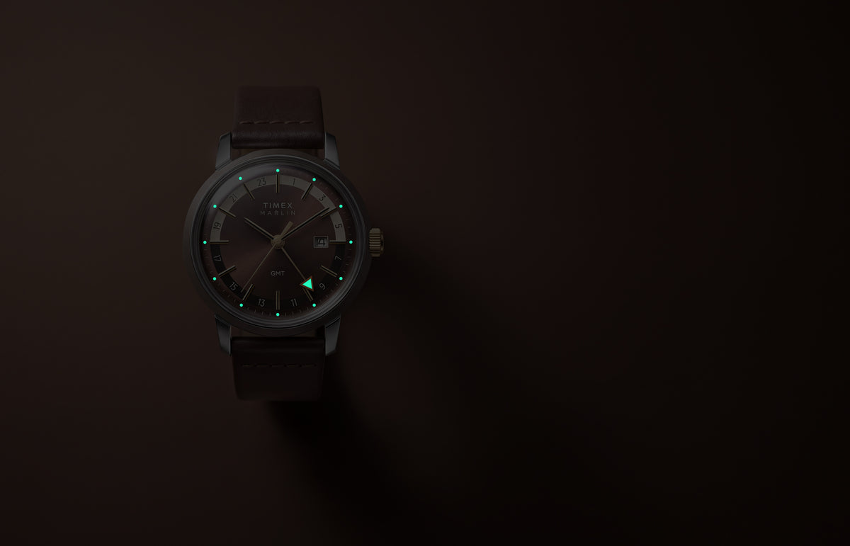 Marlin® Quartz GMT in low light with glowing hour markers and GMT hand.