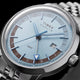 Detailed angled view of the Marlin® Quartz GMT dial, blue hands, GMT hand, and date window.