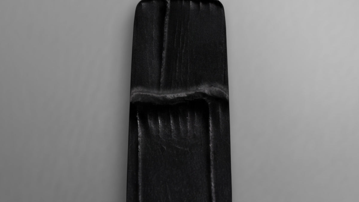 Close-up of the Cavatina® Mini’s black croc-embossed leather strap.