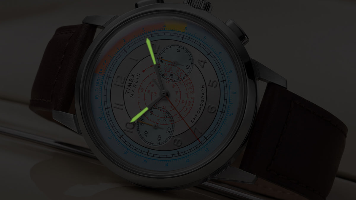 Close-up of the Marlin® Neo Classic Chronograph in low light with green luminous hands.