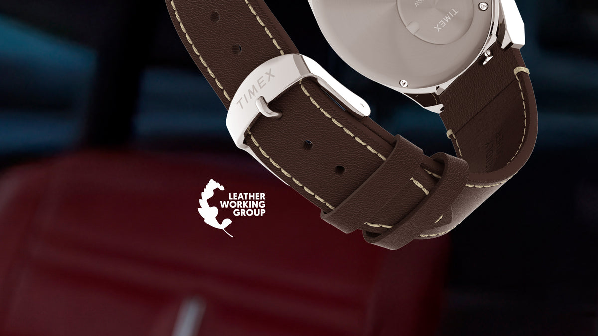 Rear view of the Q Timex Chronograph featuring a brown leather strap, silver-tone buckle, and Leather Working Group logo.
