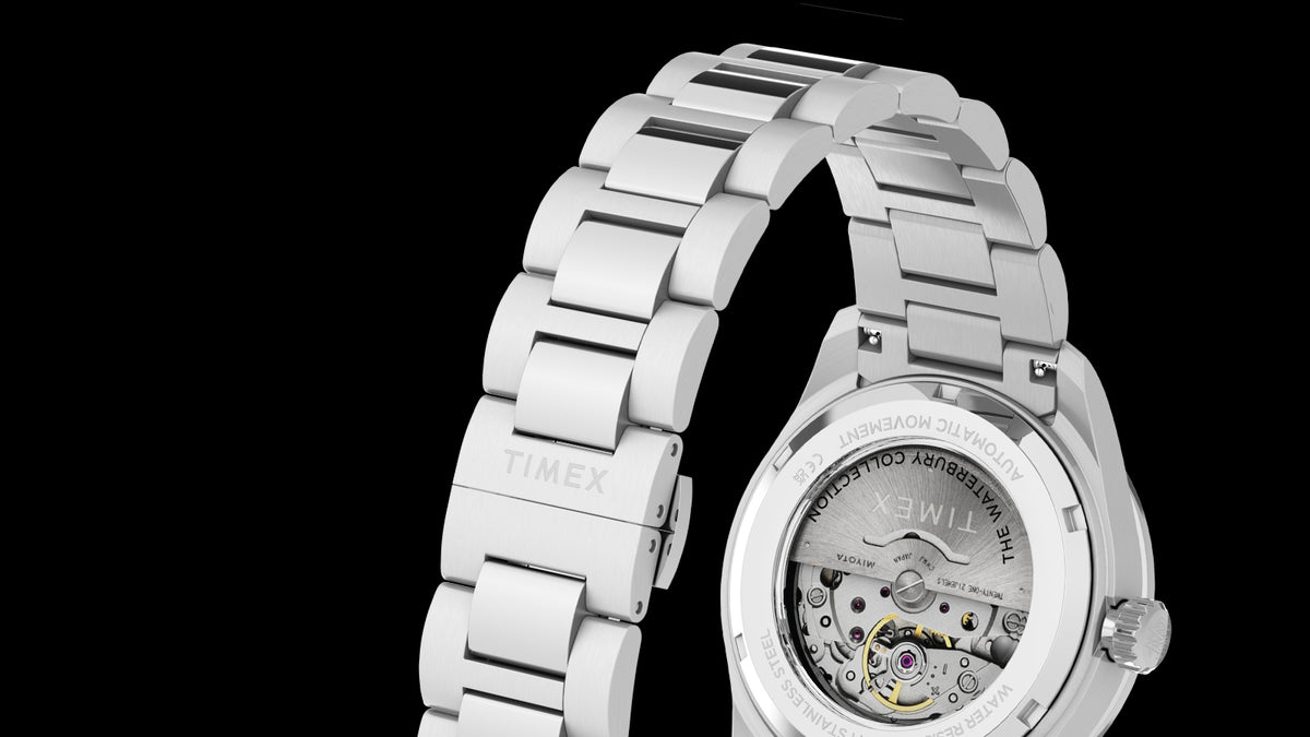 Rear view of the Waterbury Heritage Automatic, highlighting its stainless-steel bracelet and exhibition case back.