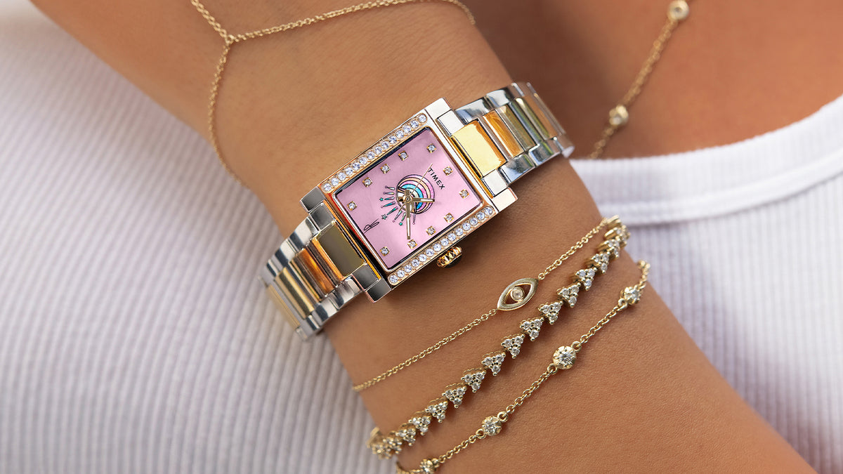 Timex x Jacquie Aiche Éclat two-tone watch styled with delicate gold and diamond bracelets.