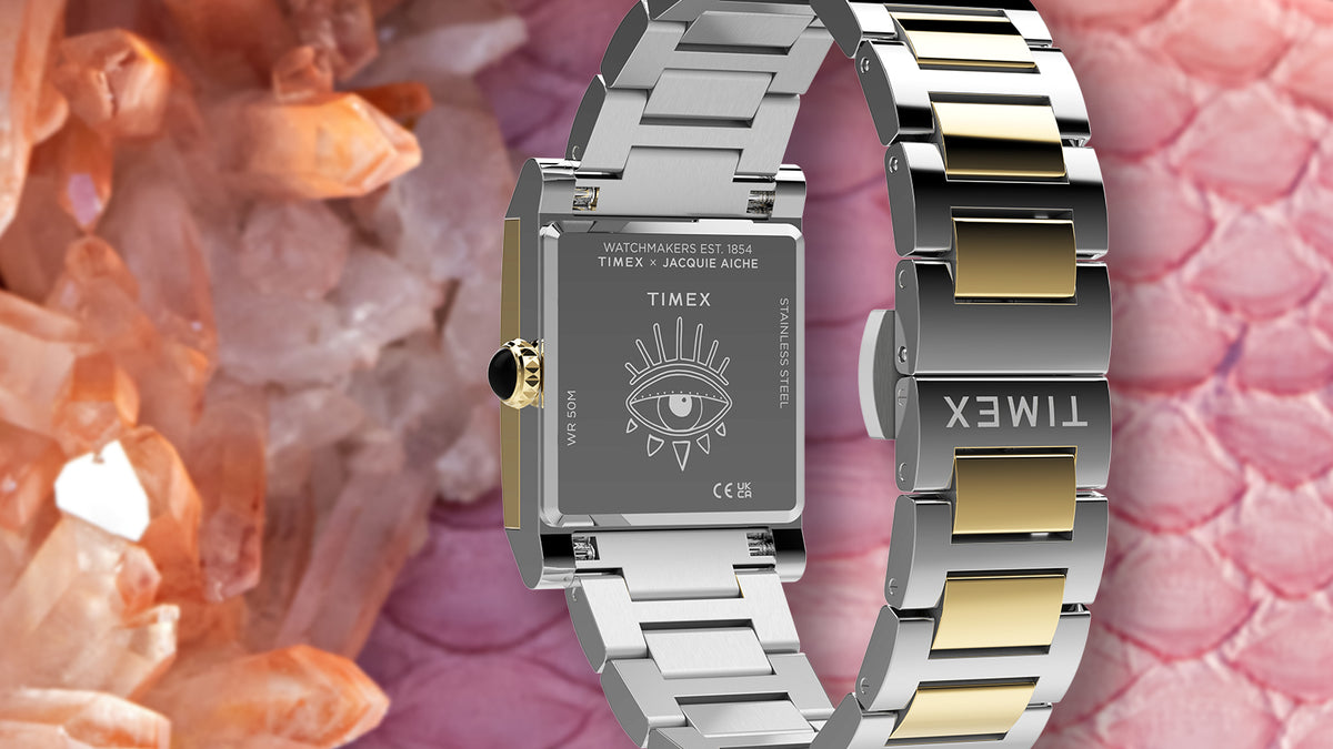 Rear view of the Éclat watch showing its engraved eye motif and two-tone stainless-steel bracelet.