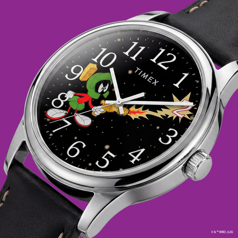TW2Y99300 Close-up of the Marvin the Martian watch dial showing Marvin firing a ray gun toward a tilted numeral 2 against a starry background.
