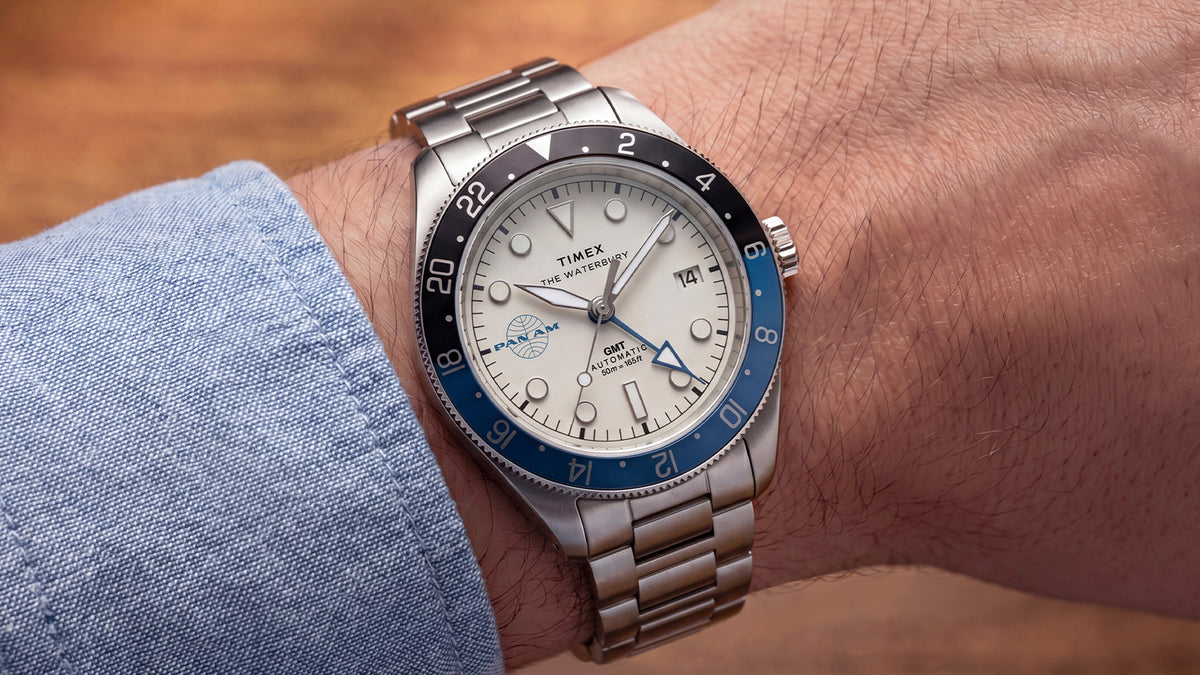 TW2Y94300 Pan Am x Timex Waterbury Automatic GMT watch with a stainless-steel bracelet worn on the wrist.