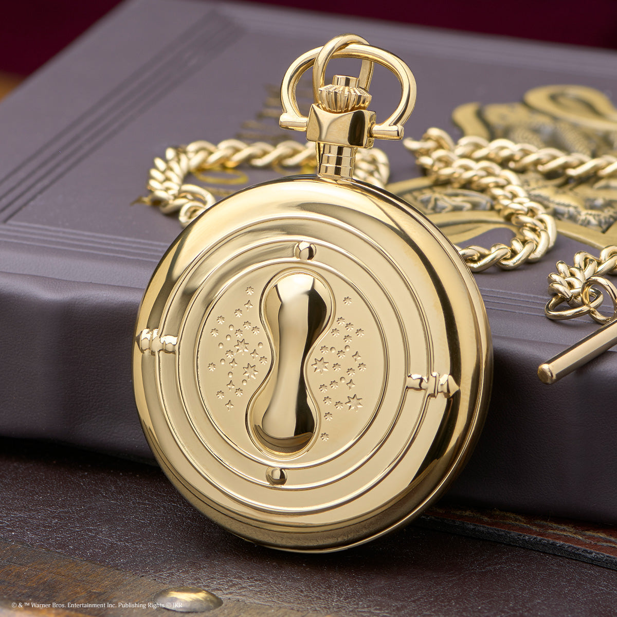 TW2Y99600 Close-up of the gold-tone case back and its raised hourglass design.