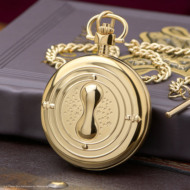 TW2Y99600 Close-up of the gold-tone case back and its raised hourglass design.