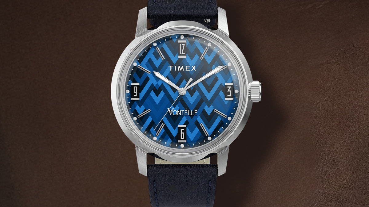 TW2Y73800 Front view of the watch, showing its silver-tone case and bright blue geometric dial.