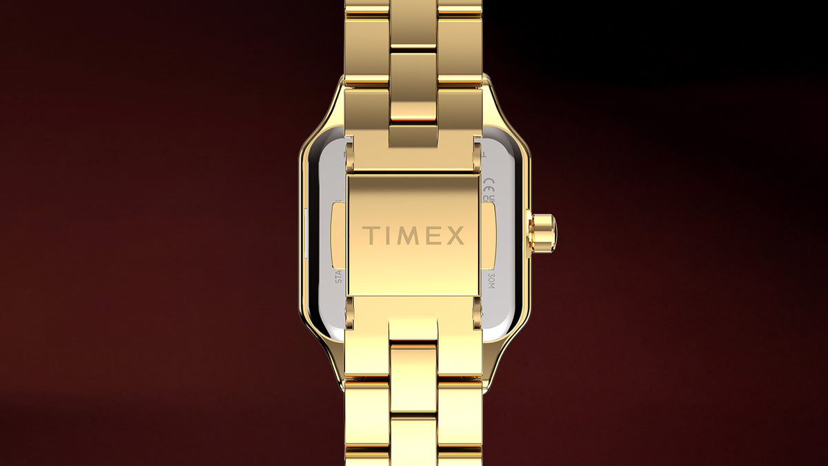 TW2Y90500 Back view of the Timex Addison watch showing its gold-tone link bracelet, silver-tone case back, and clasp engraved with the Timex logo.