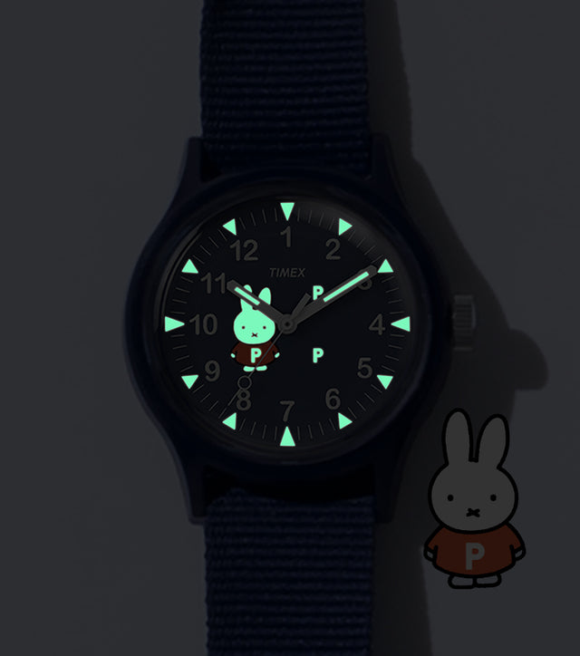 TW6A31000 Pop & Miffy by Timex MK1 watch with green glowing hands, hour markers and Miffy dial details, beside a Miffy illustration.