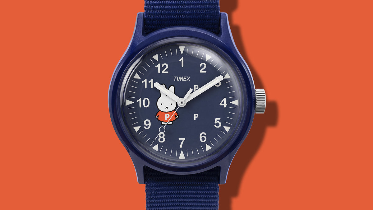TW6A31000 Close-up of the Pop & Miffy by Timex MK1 navy dial with Miffy in an orange shirt, white numerals and hands.