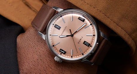Marlin Automatic with a brown strap and salmon colored dial shown on a man's wrist
