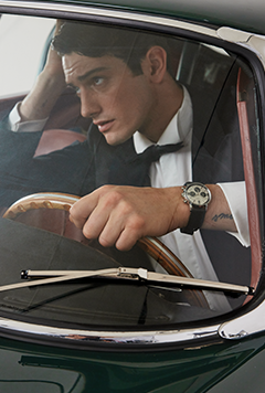 image shows a man driving with Marlin® Chronograph Tachymeter 40mm Stainless Steel Bracelet Watch on his wrist