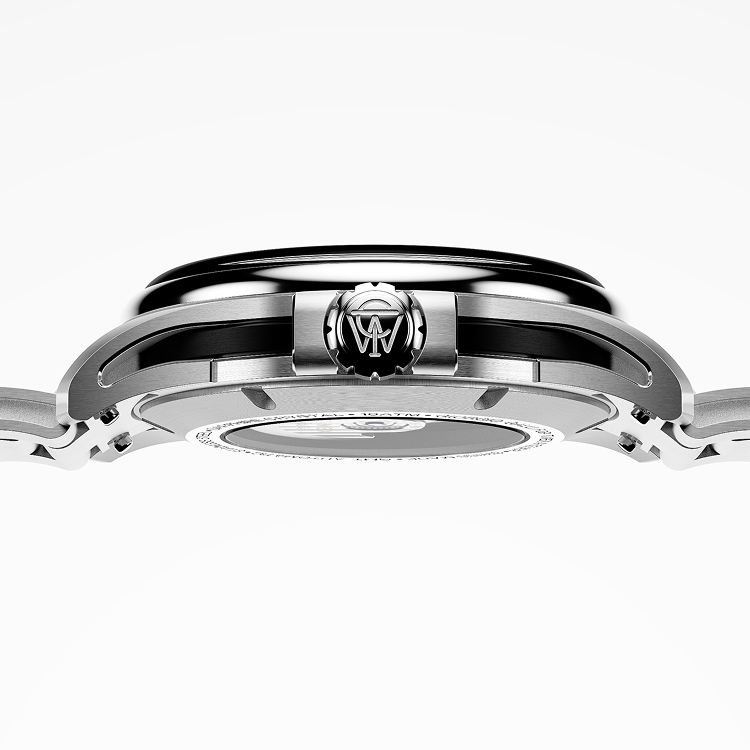 Side profile of the Timex Atelier GMT Automatic showing the slim stainless-steel case, signed crown, and architectural case design.