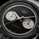 Close-up of the Timex Atelier Chronograph Automatic M1a Ti black dial featuring silver-tone sub-dials, applied markers, and polished chronograph hands.