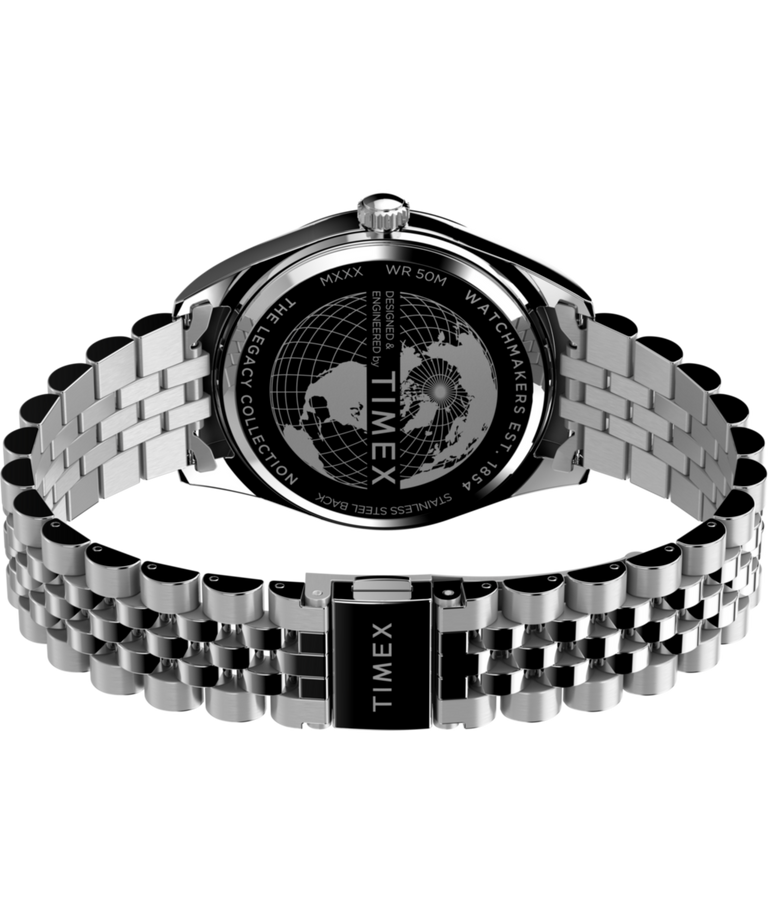 TW2V67900 Reloj Timex Legacy con indicador de día y fecha, 41 mm, correa de acero inoxidable. Imagen del fondo de la caja con accesorio.