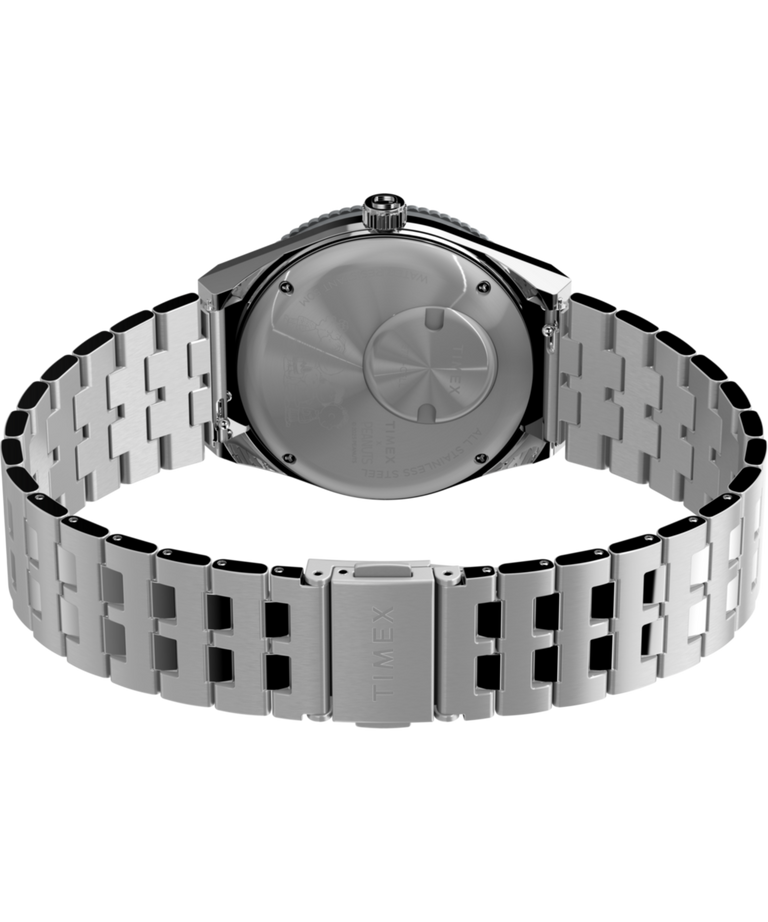 TW2W83300 Peanuts® x Q Timex® GMT, reloj de 38 mm con brazalete de acero inoxidable: imagen del fondo de la caja con accesorio